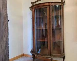 Antique Curved Glass Display Cabinet with Wood Detailing and Vintage Key