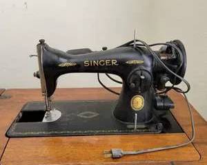 Antique Black Singer Sewing Machine with Wooden Cabinet and Drawer