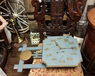 Rosewood chair, mission clock, buggy wheels, lamps.