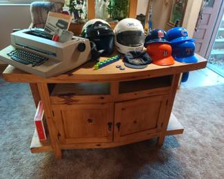 Southwestern side table, IBM selectric II, helmets