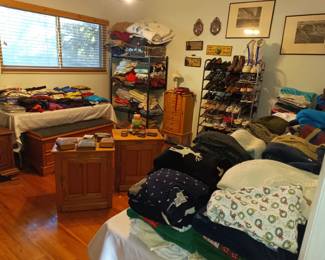 Master bedroom full of clothing