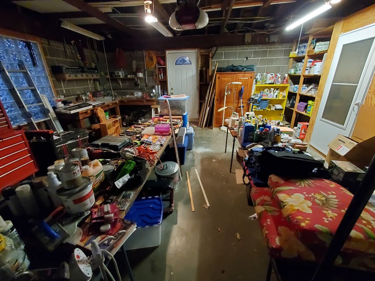 Garage full of tools, supplies, tool chests, electrical equipment, more furniture, tons of light bulbs, seat cushions, coolers, and so much more