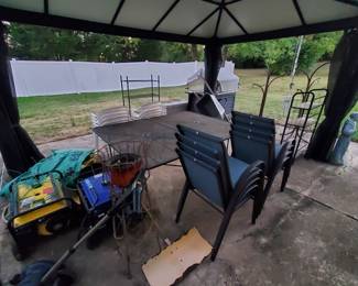 Outdoor patio furniture (tables, chairs, shelves), planters, stands, generators, statues