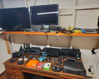Some of the electronics for sale, including TVs, Computer monitors, VHS and DVD players, headphones, ethernet cables, keyboards, mice, speakers, power strips, and more.
