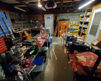 Garage full of tools, supplies, tool chests, electrical equipment, more furniture, tons of light bulbs, seat cushions, coolers, and so much more
