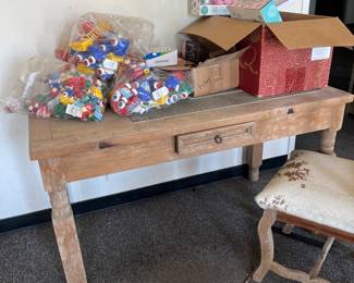 This rustic table or desk with two cowhide  covered chairs is totally awesome… I believe it was possibly part of either an equestrian ranch which the family owned or a western wear trading post that the family at one time was involved with… Either way it’s a showcase piece perfect for at home or even a retail setting… It literally looks like something out of the Colorado Ralph Lauren ranch!