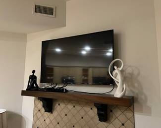 Two large smart TVs. Panasonic and Roku.
