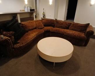Leopard print velvet sectional.  easy removal through adjacent basement doors
