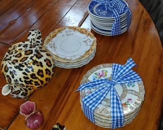 various sets of vintage plates, tea pots, urns, decor
