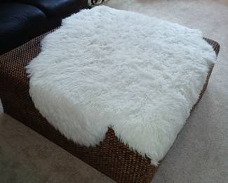 large square ottoman, white sheepskin throw