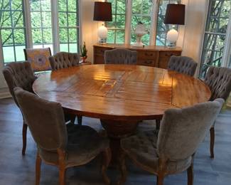 72" diameter dining table, grey upholstered tufted back dining chairs, white glass lamps,