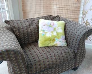 Matching brown arm chair showing details