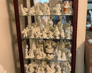 Curio cabinet full of Snow Babies