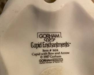 Back stamp of cupid figurines