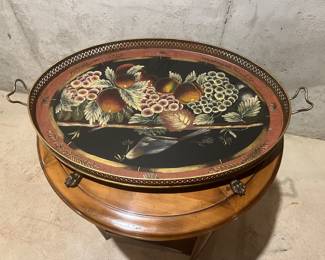 Vintage Toleware tray. Toleware trays were popular in the 17th and 18th centuries, and American versions often feature fruits, florals, and symbols. 
$45 The value of toleware trays can vary widely, from around $35 to thousands of dollars, depending on factors such as age, condition, and the quality of the painting. 
Collectors often look for pieces with unusual colors or specific designs, such as roses or a reticulated edge. 
Trays without damage to the painted design are more valuable and harder to find