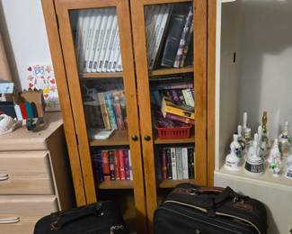 Storage Cabinet, Suitcases, Books