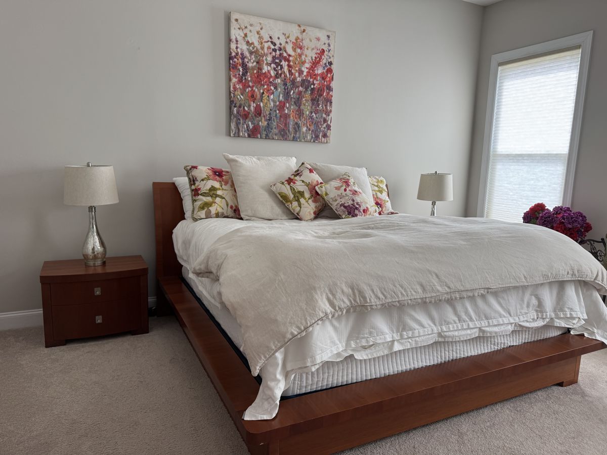 King size bed with Simmons box spring and mattress. (Bedding, lamps and nightstands are separate lots).