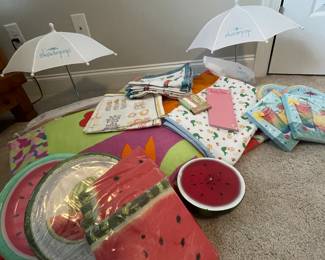 (2) Terris towels, 132x64 fish and flower theme, (2) shade pop umbrellas, a pink beach quilt 56x46, (1) watermelon candle, (1) mermaid baby throw, butterfly napkins, paper products (plates and napkins)