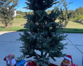 "56"" inch tree skirt, (2) wine boxes one is Santa 13"" one is a gingerbread man 16"" 2 deers larger one 8"" height smaller one height Is 4 1/2 , Merry ornament 12 "" Glass  Fitz & Floyd, Angel 10"", owl 8"", sleigh 10 1/2 x 12, 2 Teddy bears, 6ft tree w/lights, & white snow. "