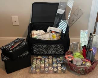 (1) Sewing room on wheels, Basket of thread needles pins, (1) Fiskers, (2)knitting needles, (1) pin frog, (2) quilt ruler, pattern bundles, measure tape flexible 
