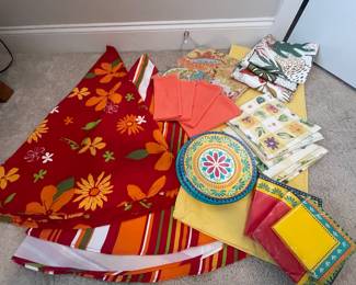 (2) round table covers, (1) square 3 pillow cases, (10) leaf napkins, (1) yellow runner (4) pks of napkins and (5) paper plates