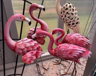 4 metal yard flamingoes plus a heron (stork? unsure). LOT 31
