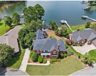 THIS EXECUTIVE HOME ON LAKE MURRAY IN CHAPIN SC 29036 IS FOR SALE. OFFERED AT 1,385,000. AGENTS PAM LAWSON AND SHELLY SIMS WITH HOME ADVANTAGE REALTY.