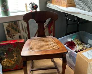 Adorable vintage child’s wooden chair with a cane seat