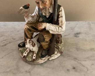 Vintage porcelain bisque figurine of old man and dog hunting