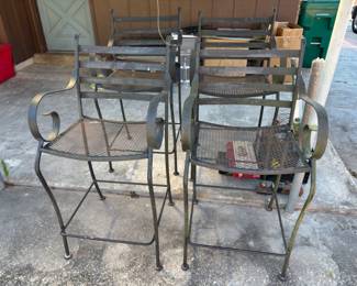 Four tall boy wrought iron outdoor chairs