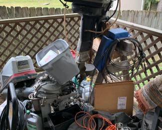 Pile of outboard motor pieces and part -sells for one money, you take it all.