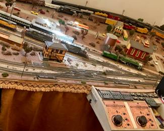 trains on train track table, table has folding legs like a table