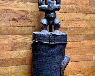 Fang tribe Africa, funeral vessel.  Leather and hand carved wood. The top comes off and the cylinder beneath is hollow.  