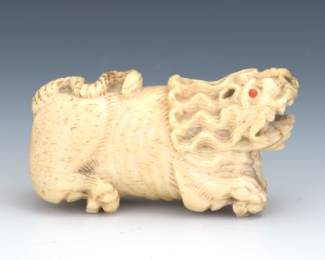 Carved Bone Figure of a Foo Dog