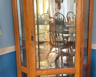Oak lighted corner curio cabinet