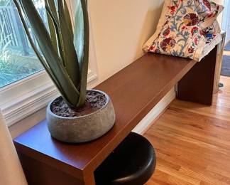 Artificial plant, sideboard and rolling chair