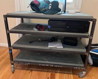 Industrial-style rolling shelf with CD player and back up power supply