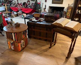 Book stand and large dictionary, antique trunk, spinning bookshelf table