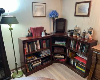 Mahogany corner bookcase, books, floor lamp, misc