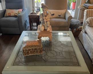 Stained glass coffee table, 2 reclining chairs, stained glass lamp, set of wooden nesting tables, and a Southeast Asian musician statue