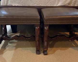 Pair of leather footstools with nailhead trim.