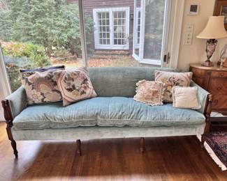 Blue velour sofa with down seating