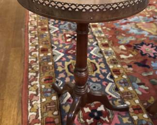 Pair of small round pedestal tables with metal edge