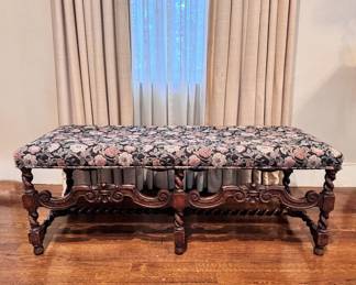 Floral upholstered bench with carved legs