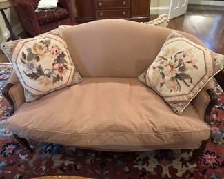 Mauve colored settee with down seating
