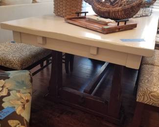Table is trestle style - white top; wood base. Table is 38" wide x 78" long; made in Canada. 