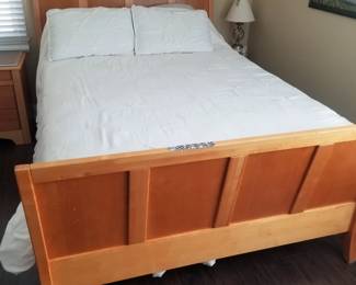 Queen bedroom suite by Millennium: queen bed; nightstand; 5-drawer armoire
