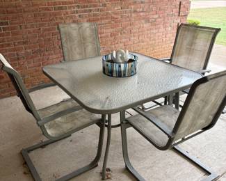 Glass top outdoor table with 4 chairs