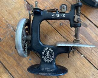 Singer miniature child’s hand crank sewing machine