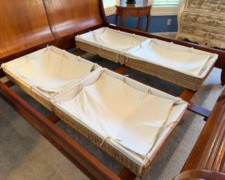 Four IKEA under-the-bed covered storage wicker baskets